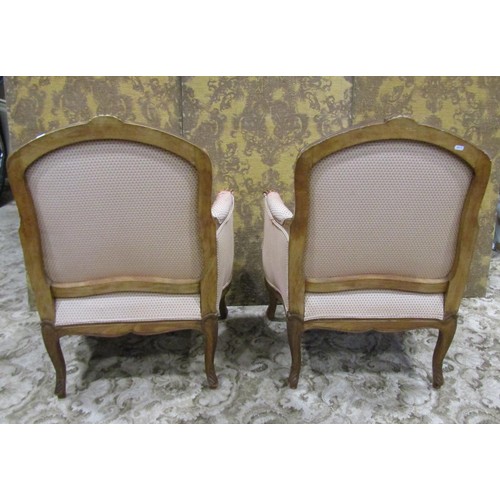 1223 - A pair of upholstered armchairs with carved show wood frames on cabriole supports