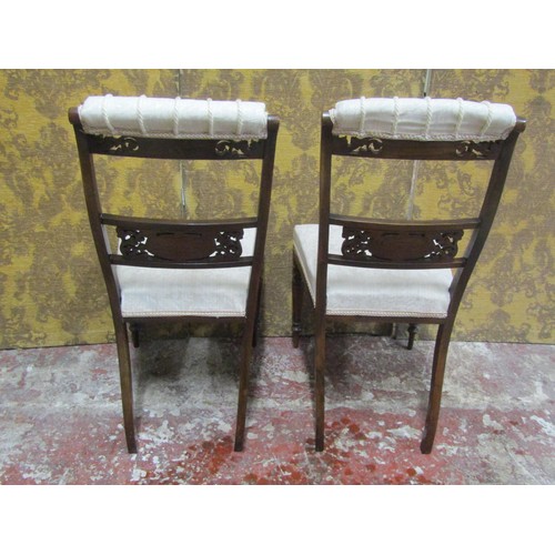 1227 - A pair of Edwardian rosewood occasional chairs, with inlaid detail, pierced and carved splats, uphol... 