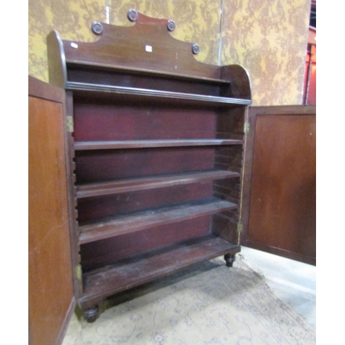 1266 - A narrow Regency mahogany side cupboard with raised back over a pair of rectangular panelled doors e... 