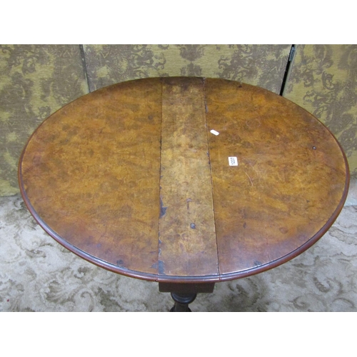 1160 - A Victorian walnut Sutherland oval drop leaf occasional table with burr and figured veneer top on tu... 