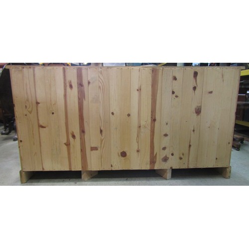 1120 - A traditional pine cabinet containing a series of 19 drawers, 180cm long x 93cm high x 48cm deep app... 