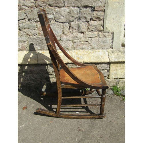 1228 - A cane back Jacobean style chair, together with a rocking chair and small footstool