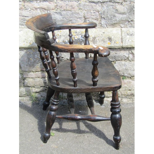 1095 - A Windsor smokers bow elbow chair principally in elm, with turned legs