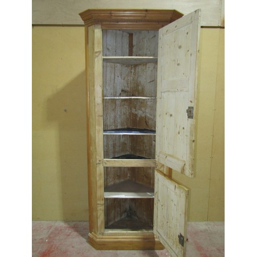 1450 - A Georgian stripped and waxed pine freestanding kitchen corner cupboard enclosed by two panelled doo... 