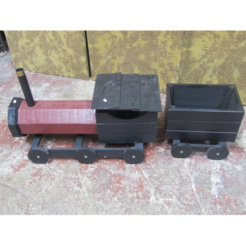 1276 - A rustic wooden scratch-built model of a steam engine and tender, with painted finish