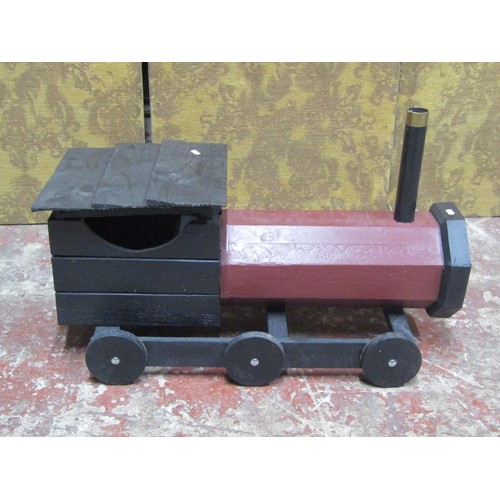 1276 - A rustic wooden scratch-built model of a steam engine and tender, with painted finish