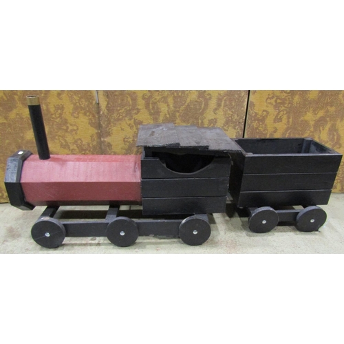 1276 - A rustic wooden scratch-built model of a steam engine and tender, with painted finish