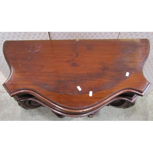 1149 - A mahogany console table on shaped supports, 93cm wide