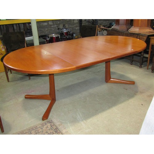 1200 - A mid century extending teak wood dining table by MacIntosh with two additional leaves and four matc... 