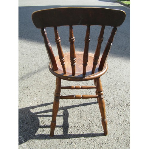 1219 - A set of seven (6+1) Windsor kitchen chairs with turned spindle backs and circular dish seats