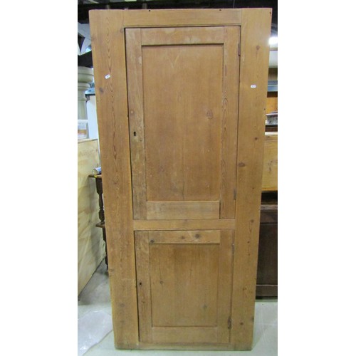 1157 - A 19th century stripped and waxed pine food/side cupboard enclosed by two panelled doors, with shelv... 