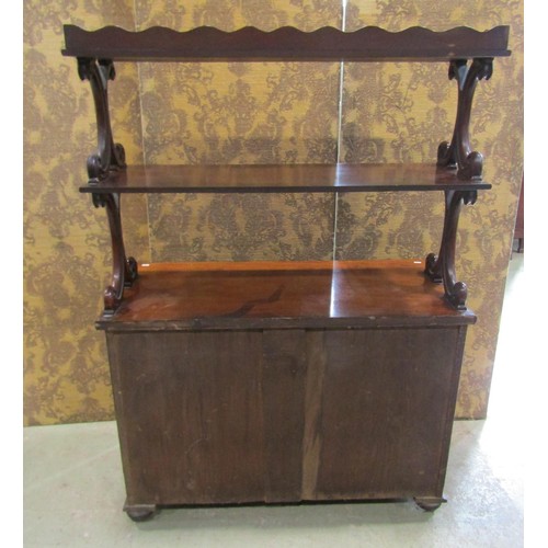 1166 - A Victorian mahogany buffet, the lower section enclosed by a pair of panelled  doors and a frieze dr... 