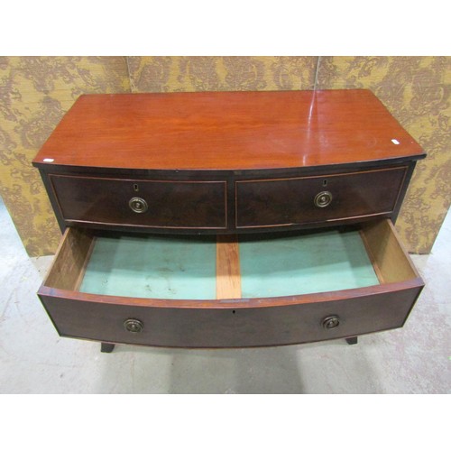 1176 - A Victorian mahogany bow fronted chest of two long and two short drawers on swept supports, 105cm wi... 