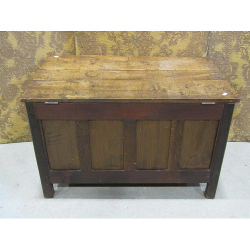 1175 - A small old English style oak coffer with carved and panelled framework, 88cm wide