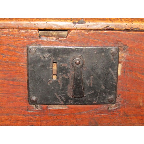 1174 - An 18th century elm six plank coffer, monogrammed I B and dated 1752, 113cm long