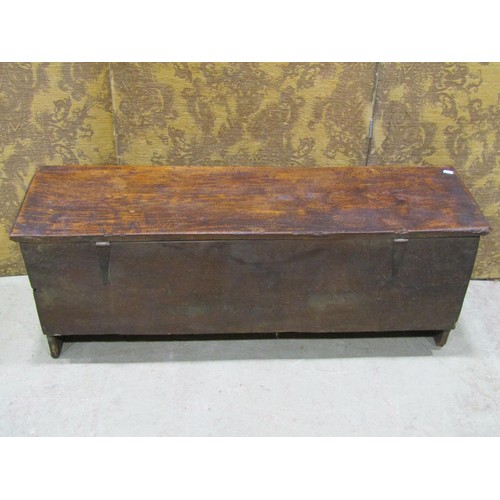 1174 - An 18th century elm six plank coffer, monogrammed I B and dated 1752, 113cm long