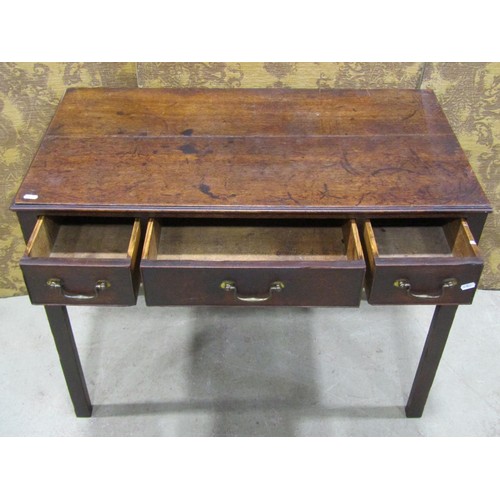 1188 - A Georgian oak countrymade side table enclosing three drawers on square cut supports, 92cm wide