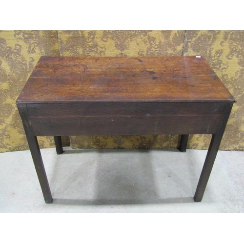 1188 - A Georgian oak countrymade side table enclosing three drawers on square cut supports, 92cm wide