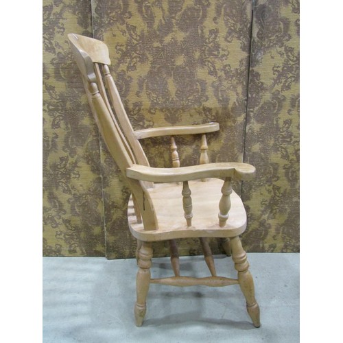 1220 - A Windsor lathe back elbow chair in beech wood