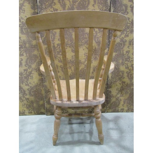 1220 - A Windsor lathe back elbow chair in beech wood