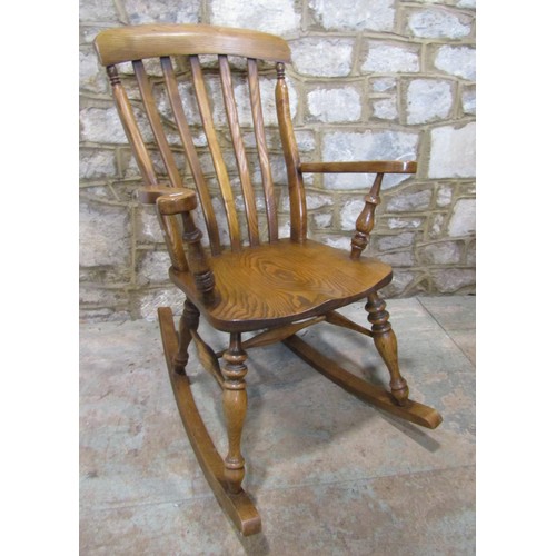 1119 - A Windsor lathe back rocking chair, principally in ashwood