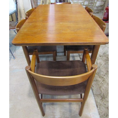 1110 - A mid-century MacIntosh teakwood extending dining table and six matching dining chairs