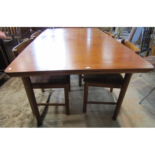 1110 - A mid-century MacIntosh teakwood extending dining table and six matching dining chairs