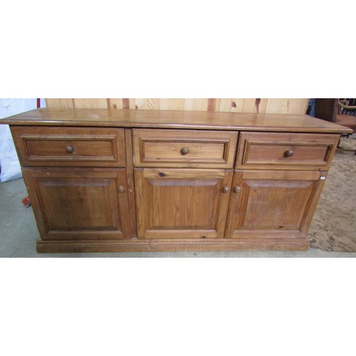 1124 - A large rustic pine dresser base enclosed by three doors and three drawers, 170cm long x 48cm deep x... 