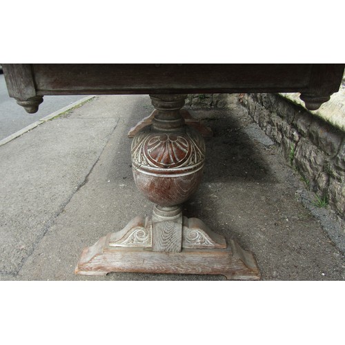 1208 - Oak refectory table in the Heals manner, raised on a pair of baluster supports, with fumed finish, 2... 