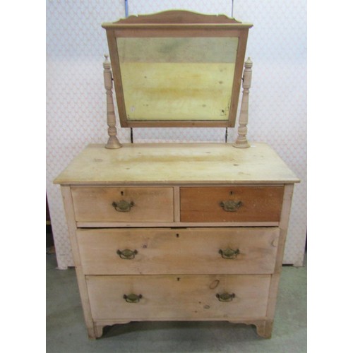 1131 - A small striped pine dressing chest of two long and two short drawers, with raised mirror back