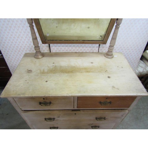 1131 - A small striped pine dressing chest of two long and two short drawers, with raised mirror back