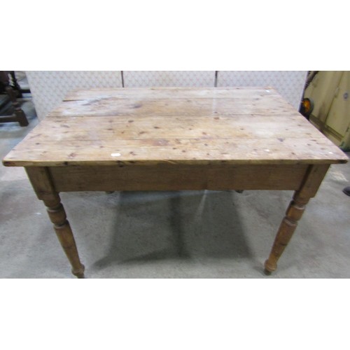 1129 - A Victorian stripped pine kitchen table, 106cm long