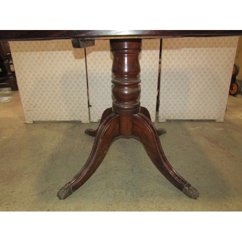 1128 - A repurposed tilt top table with Regency style pedestal base, 115cm long