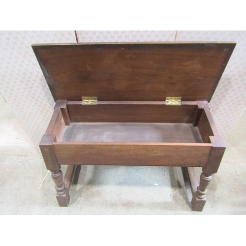 1184 - A late Victorian walnut organ stool with box set and turned  supports, 100cm wide