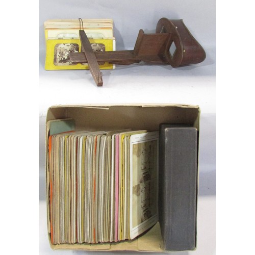 565 - A Victorian Stereoscopic viewer, with a selection of topographical cards, rural landscapes, classica... 