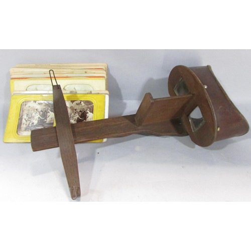 565 - A Victorian Stereoscopic viewer, with a selection of topographical cards, rural landscapes, classica... 