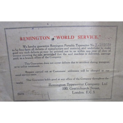 568 - A Remington red painted “World Service” portable typewriter Serial number V.195039, in its  carry ca... 