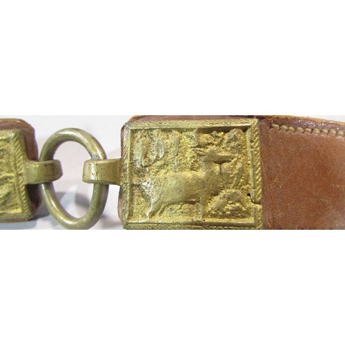 575 - A Leather hunting belt, in three sections with gilded metal links each decorated with hunting scenes... 