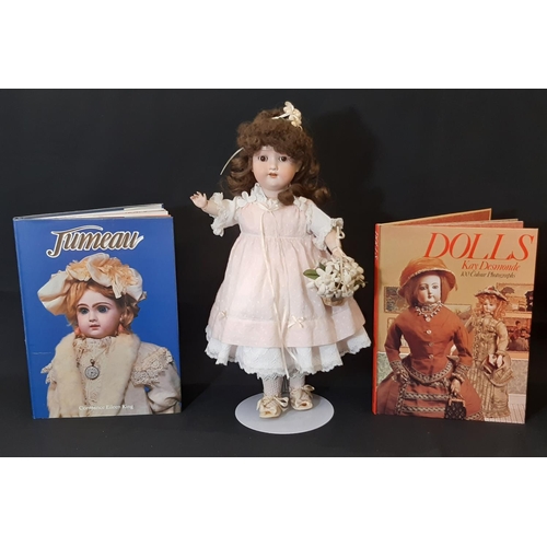 865 - An early 20th century bisque head doll by Armand Marseille with jointed composition body, closing br... 