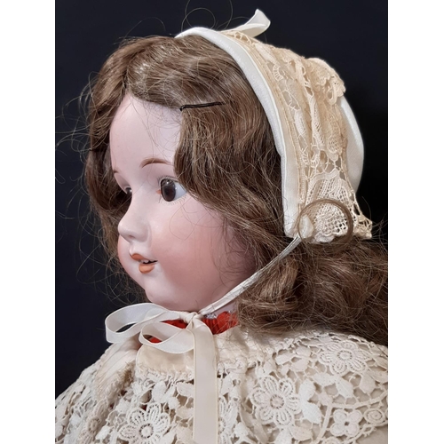 866 - An early 20th century German bisque head doll by Max Oscar Arnold with jointed composition body, clo... 