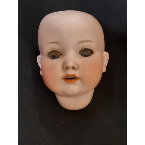 869 - Early 20th century German bisque head doll 'Melitta' by Edward Edelmann ' with closing blue eyes, op... 