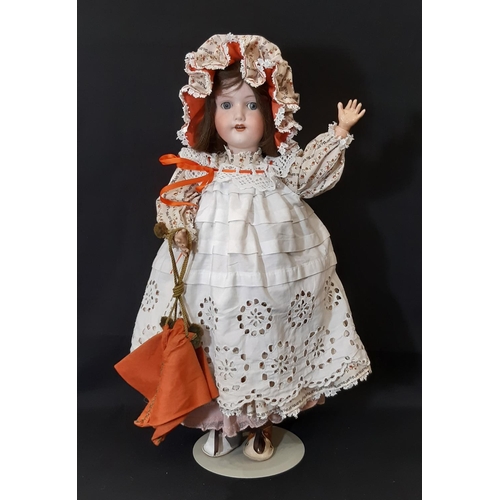 870 - An early 20th century bisque head doll by Armand Marseille with jointed composition body, closing bl... 