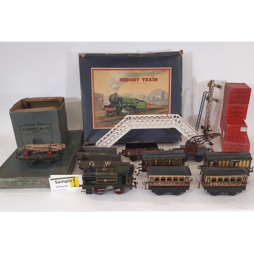 872 - A collection of pre war Hornby 0 gauge railway models including the following: clockwork locomotive ... 