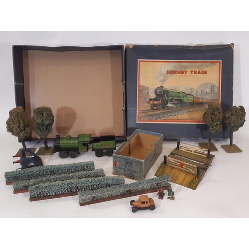 872 - A collection of pre war Hornby 0 gauge railway models including the following: clockwork locomotive ... 