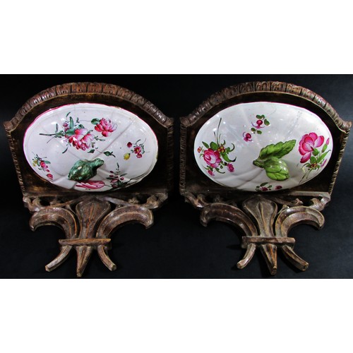 75 - A pair of 19th century French carved wood brackets with fleur-de-lis, each incorporating floral cera... 