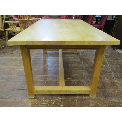 1339 - A contemporary ash wood farmhouse dining table with heavy plank top, raised on four square cut suppo... 