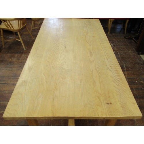 1339 - A contemporary ash wood farmhouse dining table with heavy plank top, raised on four square cut suppo... 