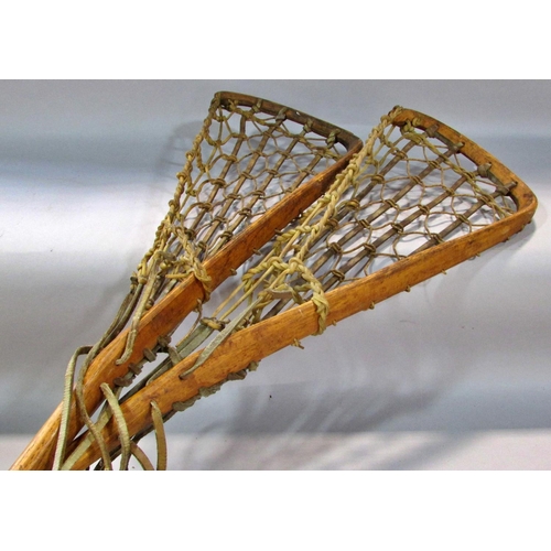 573 - Two Vintage Lacrosse sticks with leather and gut mesh, both 110cm long approximately and two vintage... 