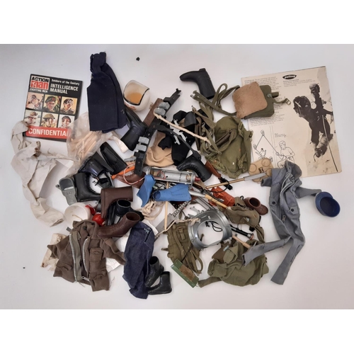 883 - Two GI Joe dolls by Hasbro ©1964 together with a large quantity of unsorted clothing, diving and mil... 