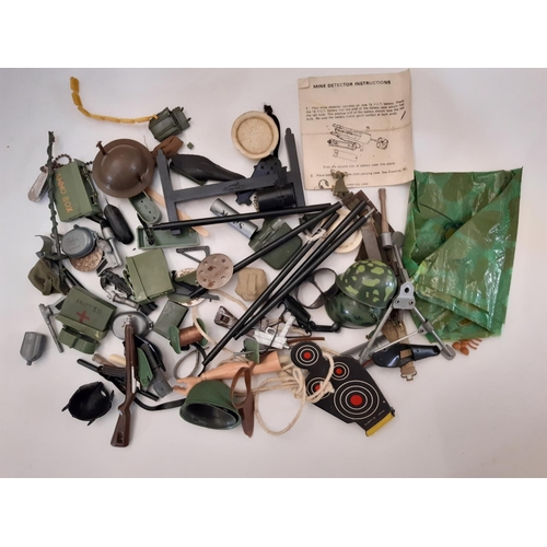 883 - Two GI Joe dolls by Hasbro ©1964 together with a large quantity of unsorted clothing, diving and mil... 